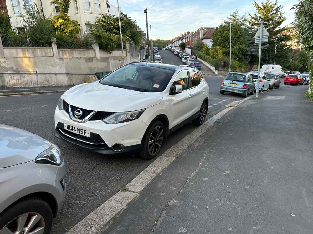 Photograph of WG14 NSF - a White Nissan Qasqai parked in Hollingdean by a non-resident who uses the local area as part of their Brighton commute. The first of five photographs supplied by the residents of Hollingdean.