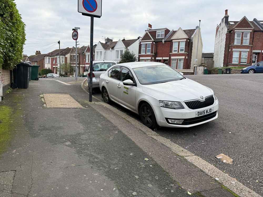 Photograph of DA15 WJD - a White Skoda Octavia taxi parked in Hollingdean by a non-resident. The thirteenth of nineteen photographs supplied by the residents of Hollingdean.