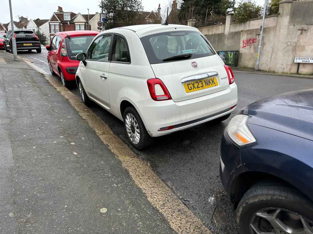 Photograph of GX23 NKK - a White Fiat 500 parked in Hollingdean by a non-resident who uses the local area as part of their Brighton commute. The first of three photographs supplied by the residents of Hollingdean.