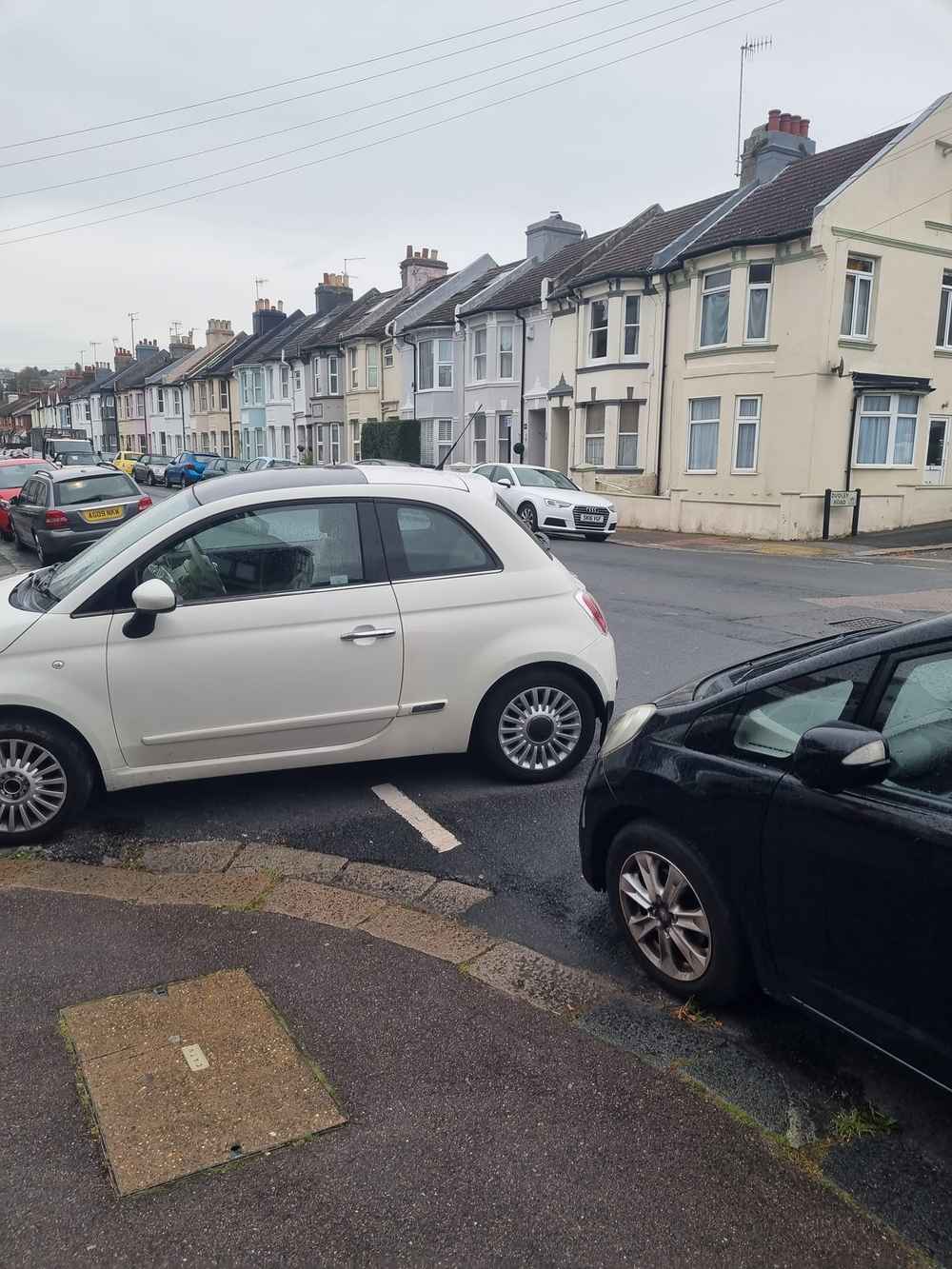 Photograph of HJ59 OMY - a White Fiat 500 parked in Hollingdean by a non-resident who uses the local area as part of their Brighton commute. The third of three photographs supplied by the residents of Hollingdean.