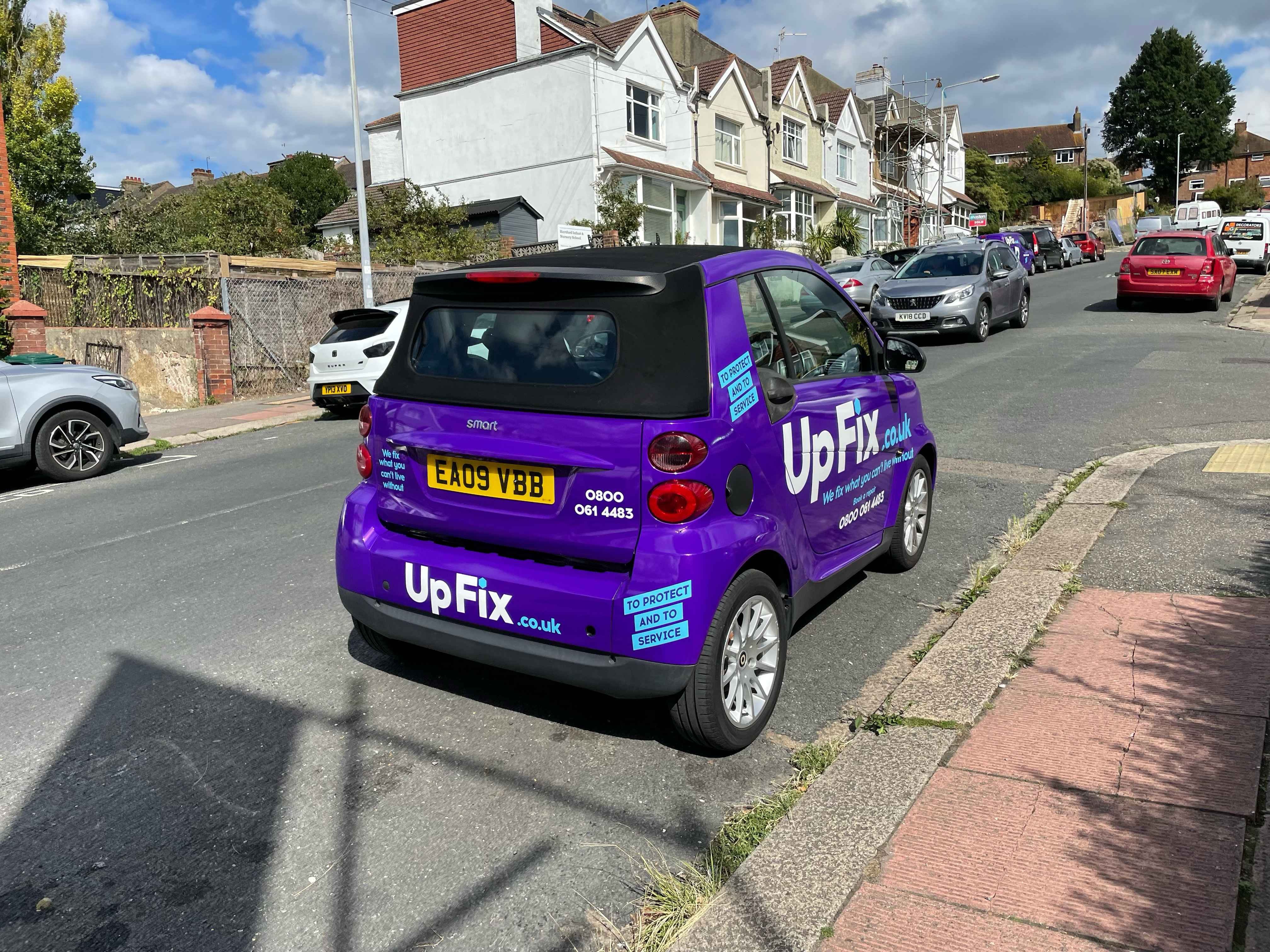 Photograph of EA09 VBB - a Purple Smart Fortwo Cabriolet parked in Hollingdean by a non-resident. 