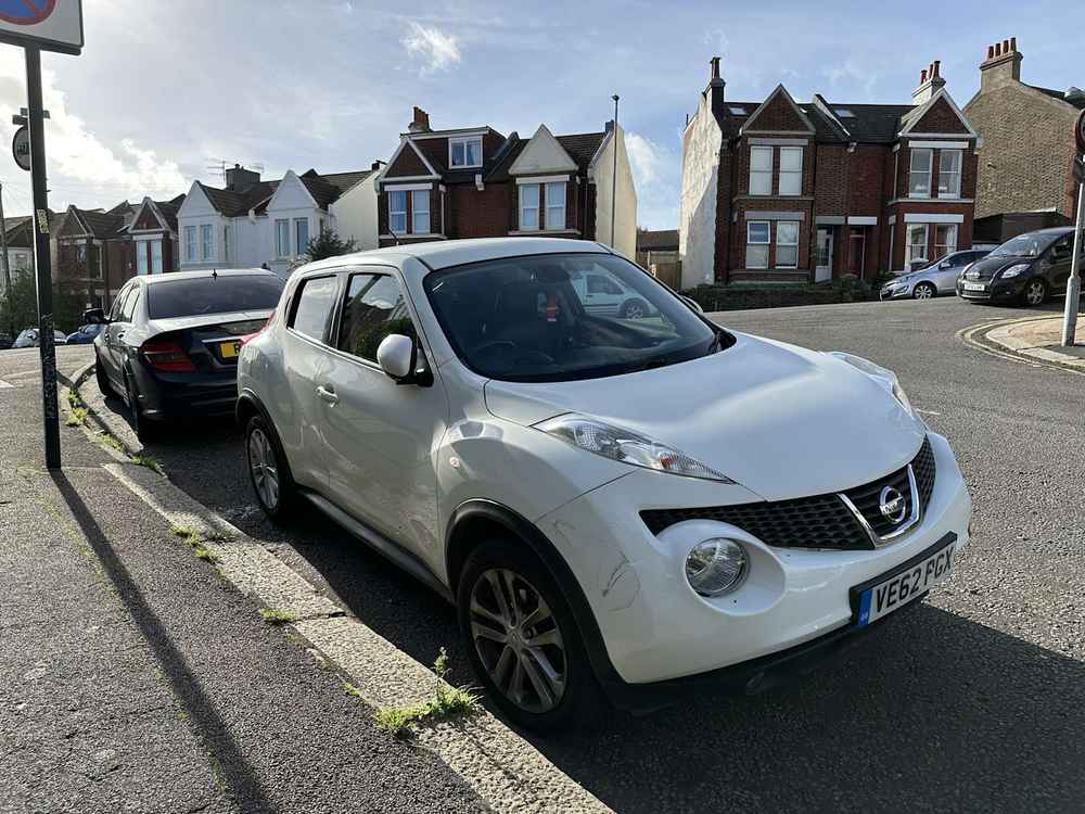 Photograph of VE62 PGX - a White Nissan Juke parked in Hollingdean by a non-resident who uses the local area as part of their Brighton commute. 