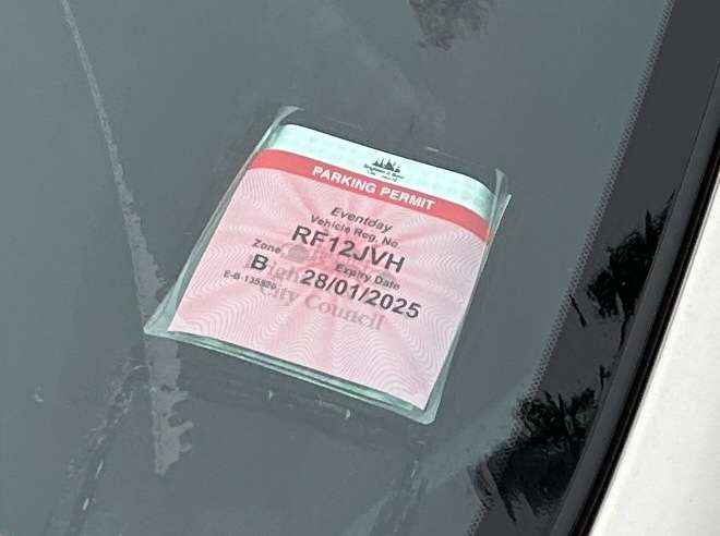 Photograph of RF12 JVH - a White Nissan Juke parked in Hollingdean by a non-resident who uses the local area as part of their Brighton commute. The first of twenty-five photographs supplied by the residents of Hollingdean.