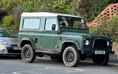 R171 GCW, a Green Land Rover Defender parked in Hollingdean