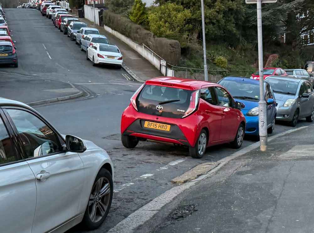Photograph of BF15 HRO - a Red Toyota Aygo parked in Hollingdean by a non-resident who uses the local area as part of their Brighton commute. The sixth of six photographs supplied by the residents of Hollingdean.