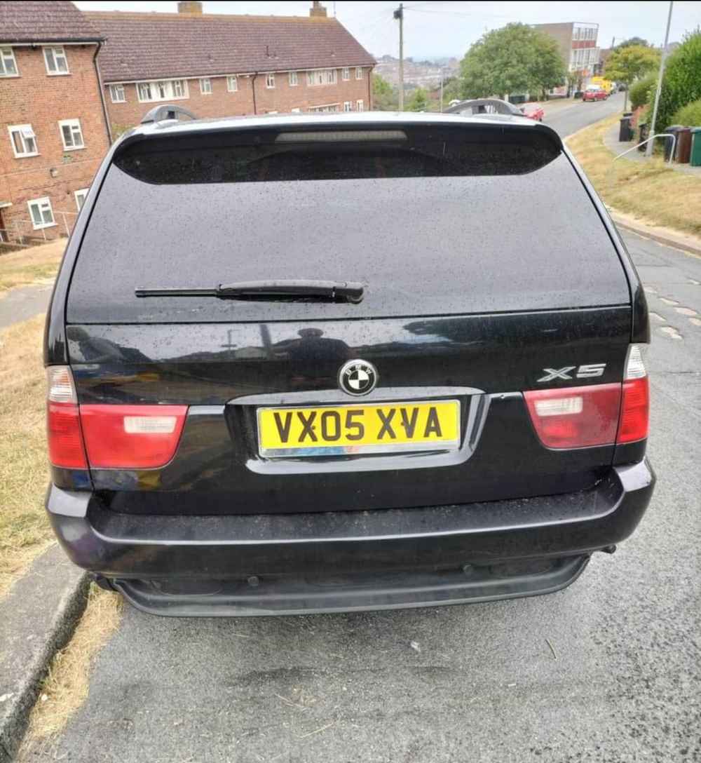 Photograph of VX05 XVA - a Black BMW X5 parked in Hollingdean by a non-resident and stored here whilst a dodgy car dealer attempts to sell it. The second of five photographs supplied by the residents of Hollingdean.