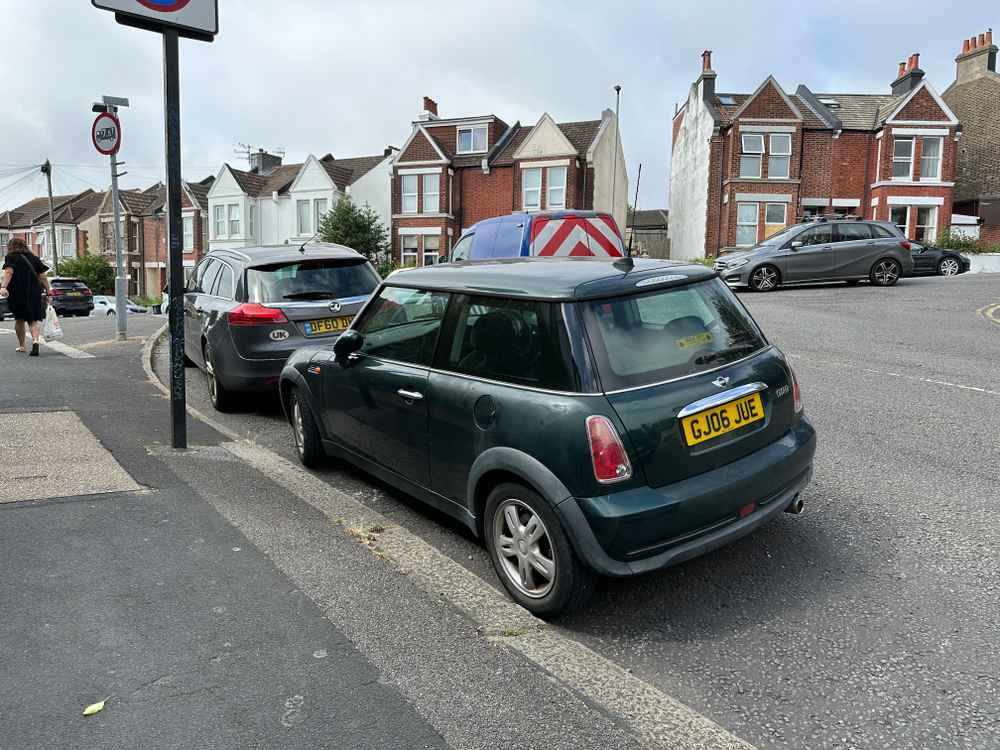 Photograph of GJ06 JUE - a Green Mini Cooper parked in Hollingdean by a non-resident. The fifteenth of seventeen photographs supplied by the residents of Hollingdean.