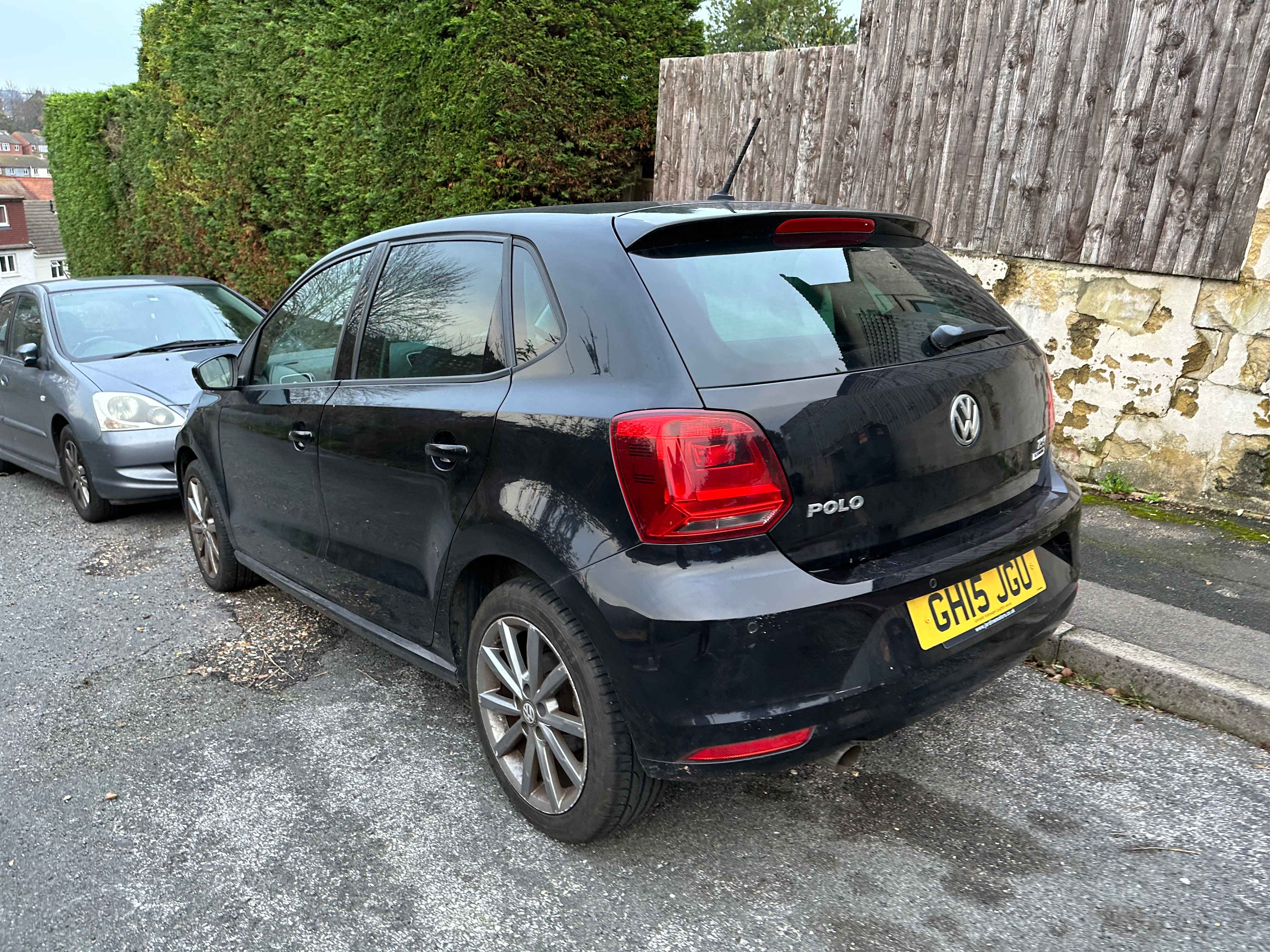 Photograph of GH15 JGU - a Black Volkswagen Polo parked in Hollingdean by a non-resident. The third of three photographs supplied by the residents of Hollingdean.