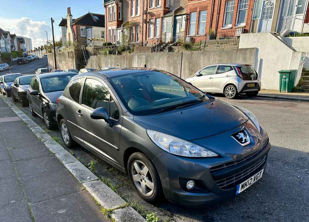 Photograph of MK12 VGT - a Grey Peugeot 207 parked in Hollingdean by a non-resident who uses the local area as part of their Brighton commute. The third of six photographs supplied by the residents of Hollingdean.