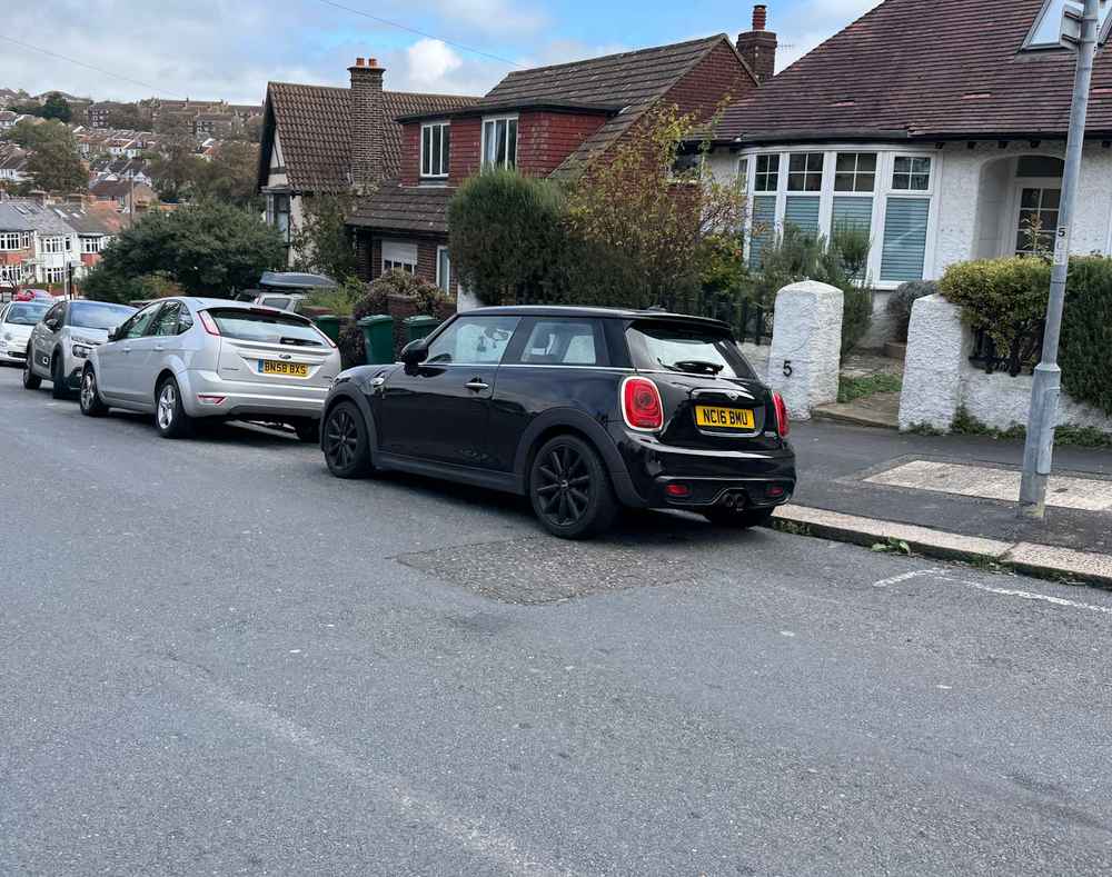 Photograph of NC16 BMU - a Black Mini Cooper parked in Hollingdean by a non-resident who uses the local area as part of their Brighton commute. The thirteenth of thirteen photographs supplied by the residents of Hollingdean.