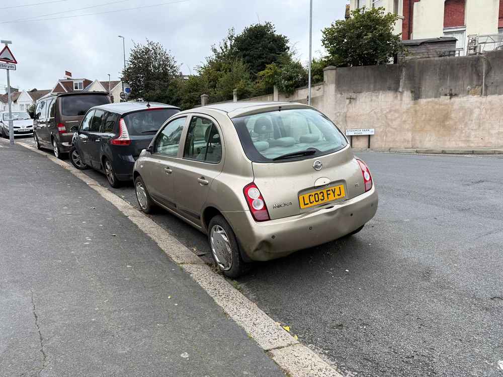 Photograph of LC03 FYJ - a Gold Nissan Micra parked in Hollingdean by a non-resident, and potentially abandoned. The twenty-first of twenty-eight photographs supplied by the residents of Hollingdean.