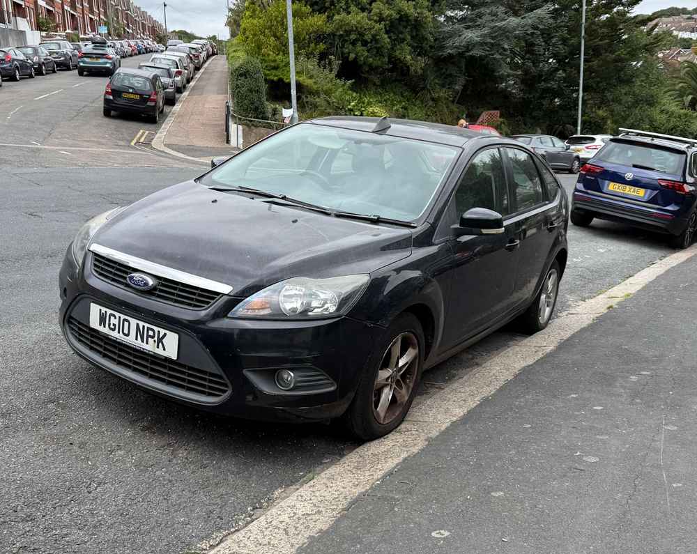 Photograph of WG10 NPK - a Black Ford Focus parked in Hollingdean by a non-resident. The eleventh of seventeen photographs supplied by the residents of Hollingdean.