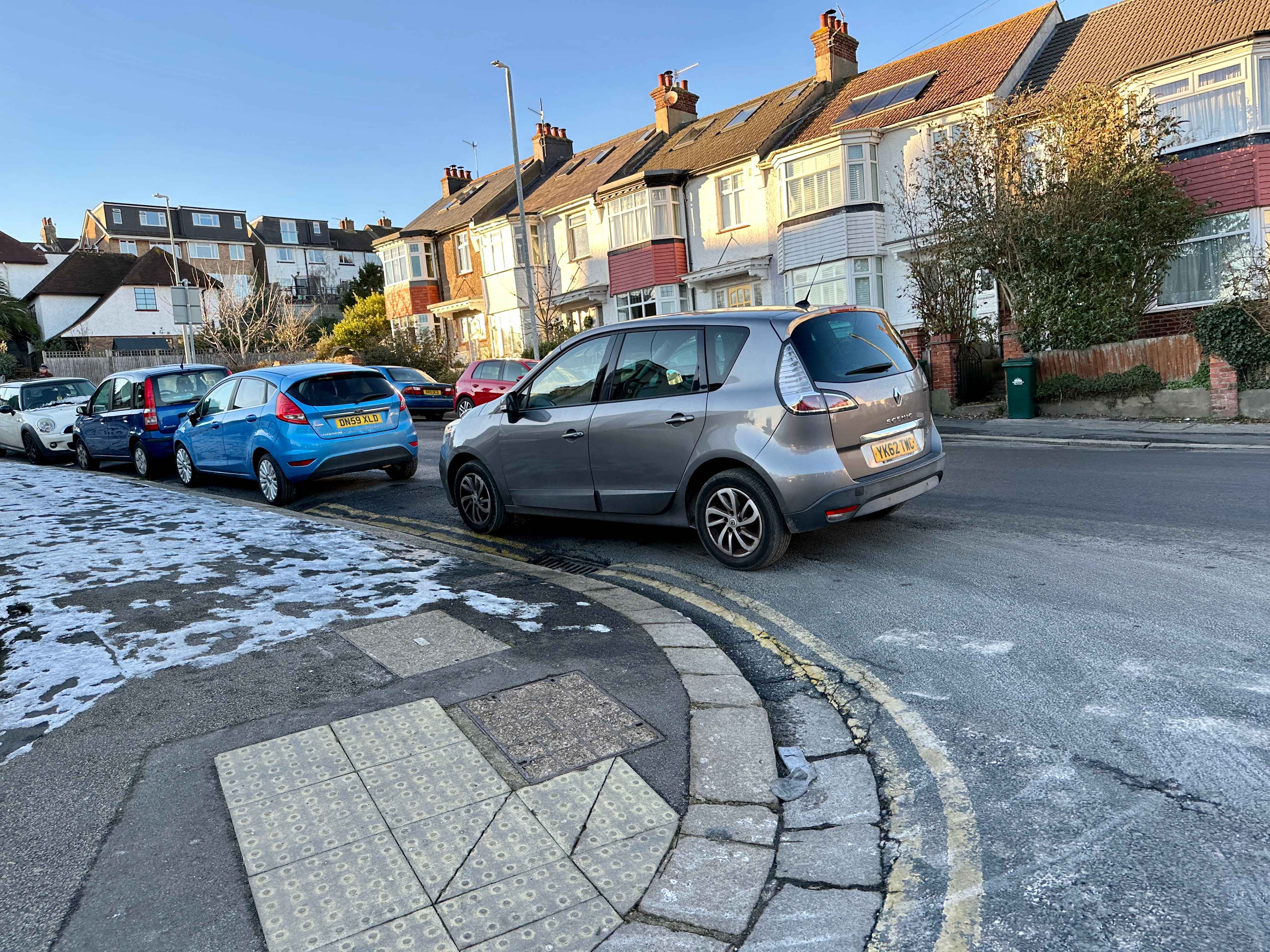 Photograph of YK62 TWC - a Gold Renault Scenic parked in Hollingdean by a non-resident who uses the local area as part of their Brighton commute. 