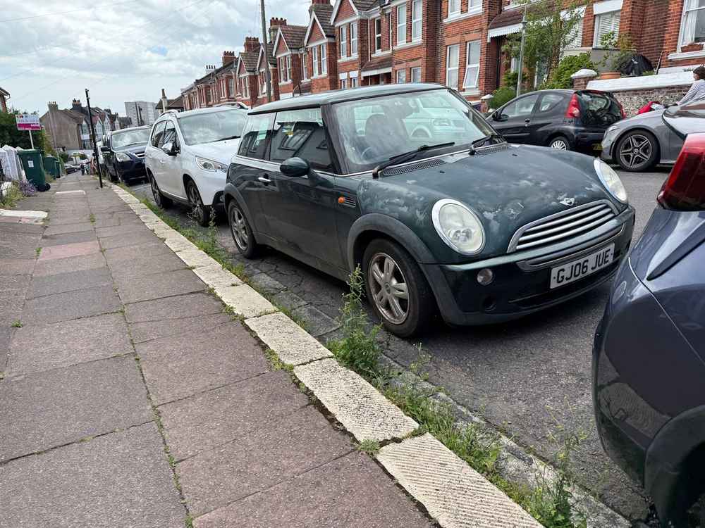 Photograph of GJ06 JUE - a Green Mini Cooper parked in Hollingdean by a non-resident. The twenty-third of twenty-four photographs supplied by the residents of Hollingdean.