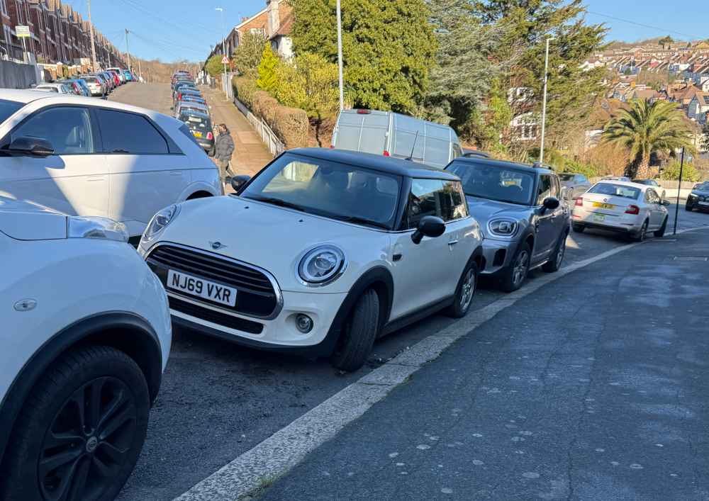 Photograph of NJ69 VXR - a Beige Mini Cooper parked in Hollingdean by a non-resident. The third of five photographs supplied by the residents of Hollingdean.