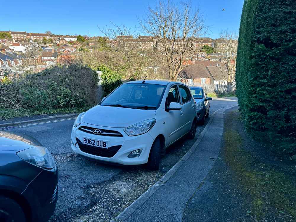 Photograph of RO62 OUB - a White Hyundai i10 parked in Hollingdean by a non-resident. The second of four photographs supplied by the residents of Hollingdean.