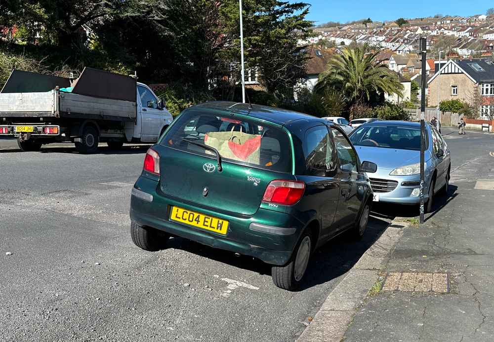 Photograph of LC04 ELW - a Green Toyota Yaris parked in Hollingdean by a non-resident. The twelfth of twelve photographs supplied by the residents of Hollingdean.
