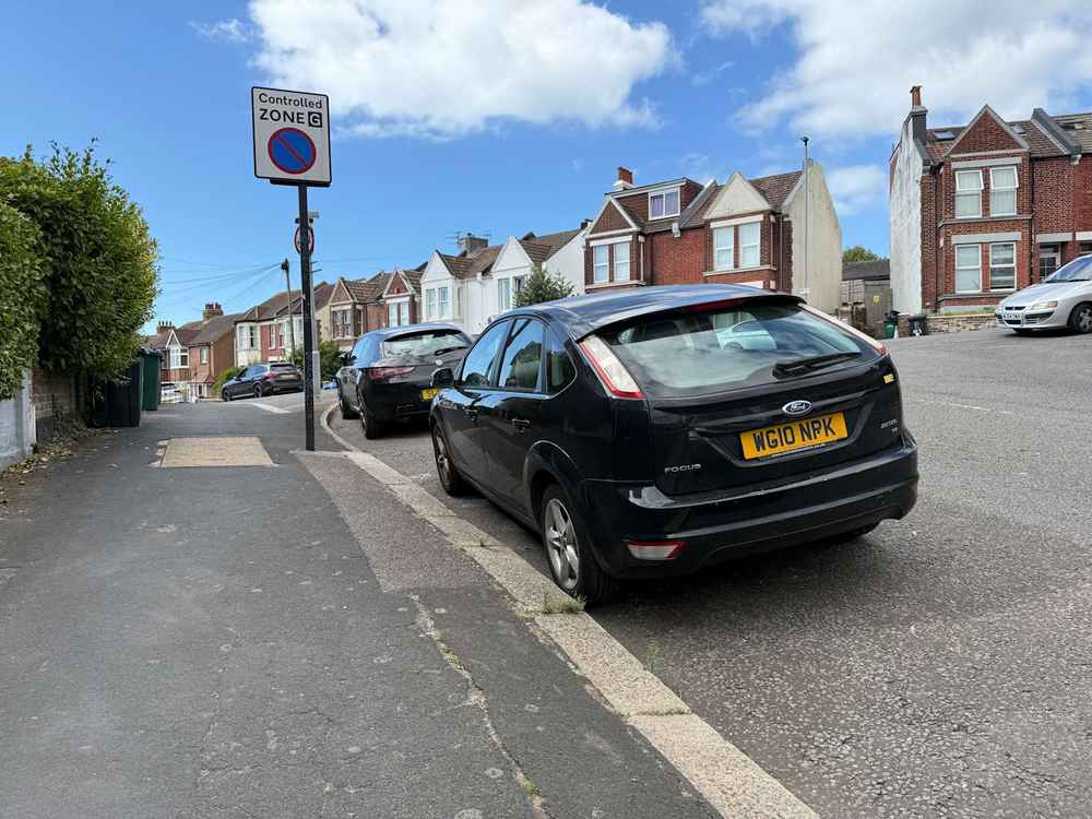 Photograph of WG10 NPK - a Black Ford Focus parked in Hollingdean by a non-resident. The tenth of seventeen photographs supplied by the residents of Hollingdean.