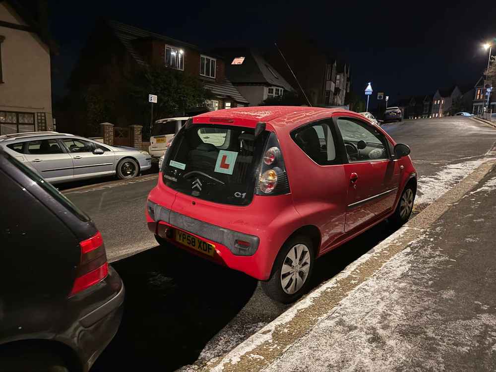 Photograph of YP58 XDF - a Red Citroen C1 parked in Hollingdean by a non-resident, and potentially abandoned. The nineteenth of twenty photographs supplied by the residents of Hollingdean.