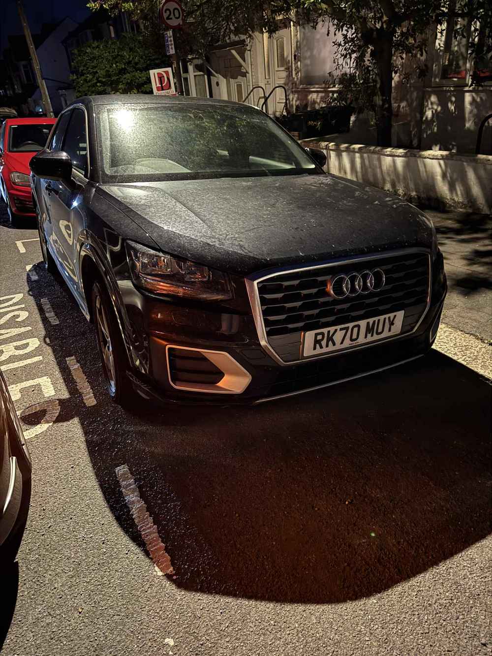 Photograph of RK70 MUY - a Black Audi Q2 parked in Hollingdean by a non-resident. The first of three photographs supplied by the residents of Hollingdean.