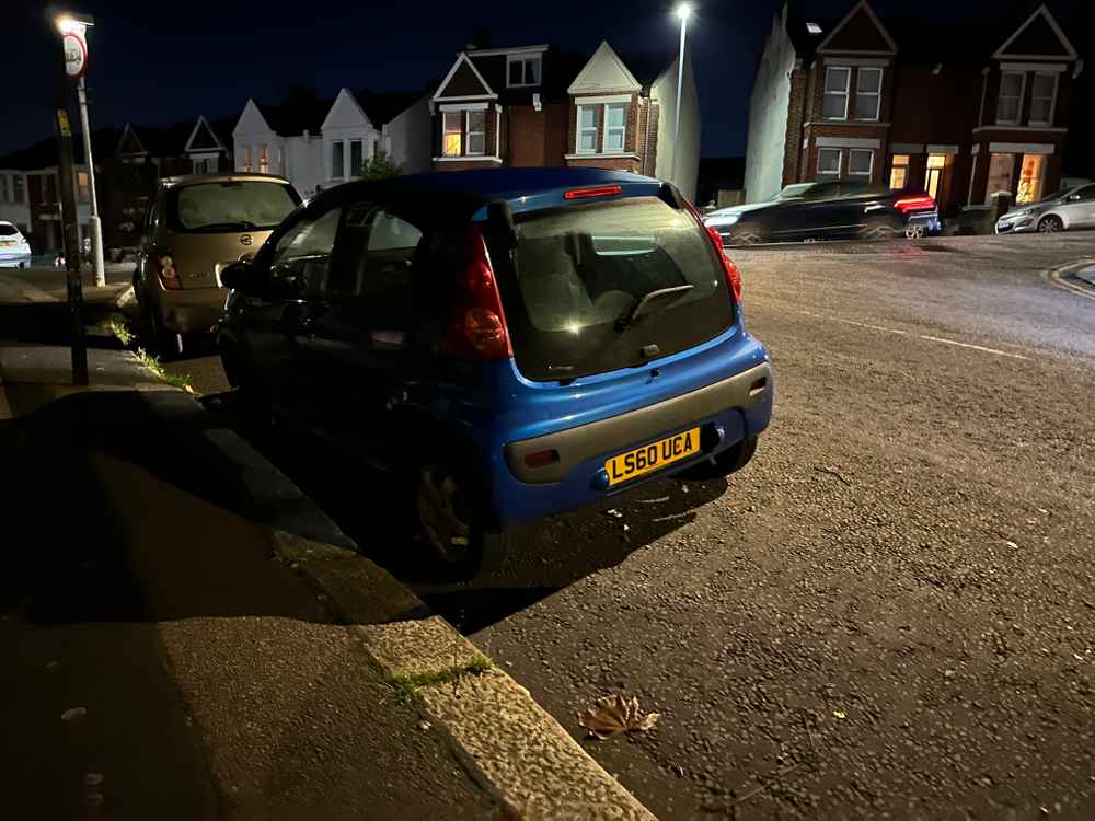 Photograph of LS60 UCA - a Blue Peugeot 107 parked in Hollingdean by a non-resident. The fourth of thirteen photographs supplied by the residents of Hollingdean.