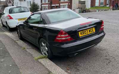 KR03 WGE, a Black Mercedes SLK parked in Hollingdean