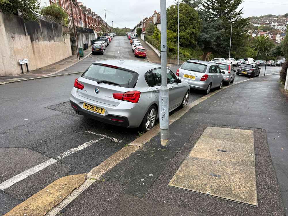 Photograph of PF66 BYV - a Silver BMW 1 Series parked in Hollingdean by a non-resident, and potentially abandoned. The second of three photographs supplied by the residents of Hollingdean.