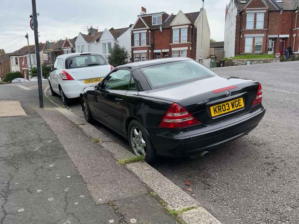 Photograph of KR03 WGE - a Black Mercedes SLK parked in Hollingdean by a non-resident. 