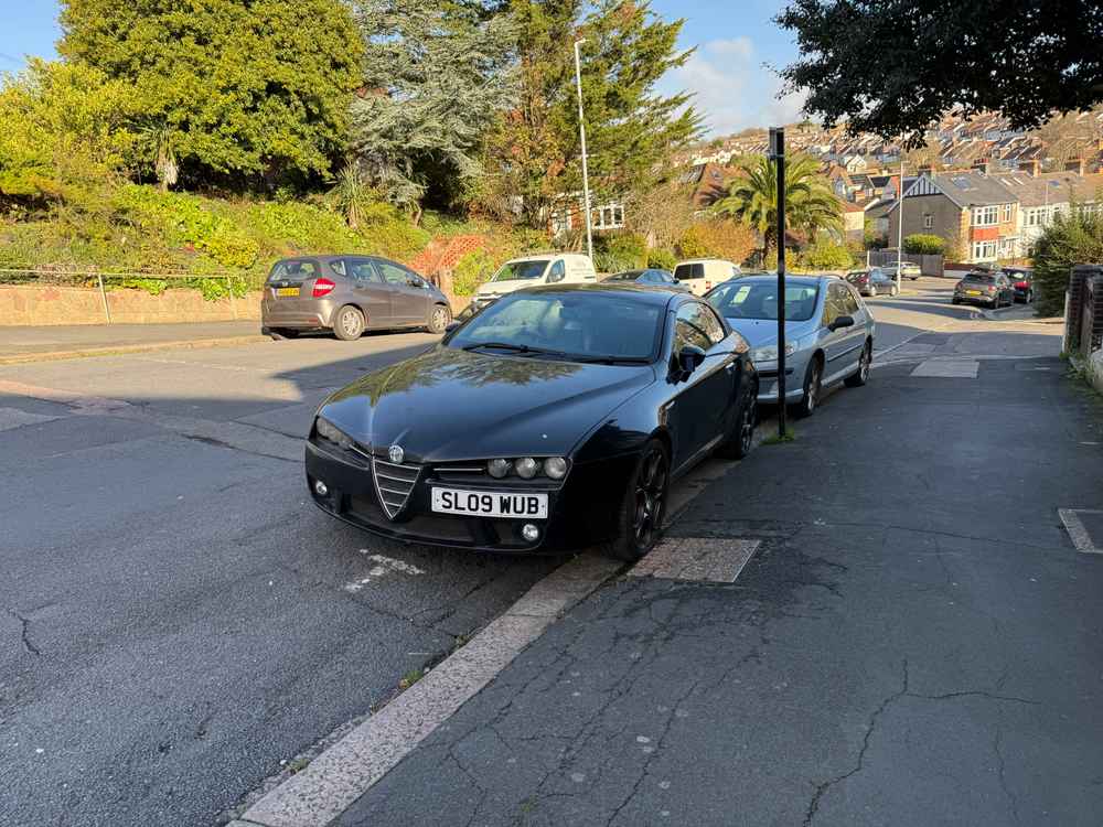 Photograph of SL09 WUB - a Black Alfa Romeo Brera parked in Hollingdean by a non-resident. The thirty-eighth of forty-two photographs supplied by the residents of Hollingdean.