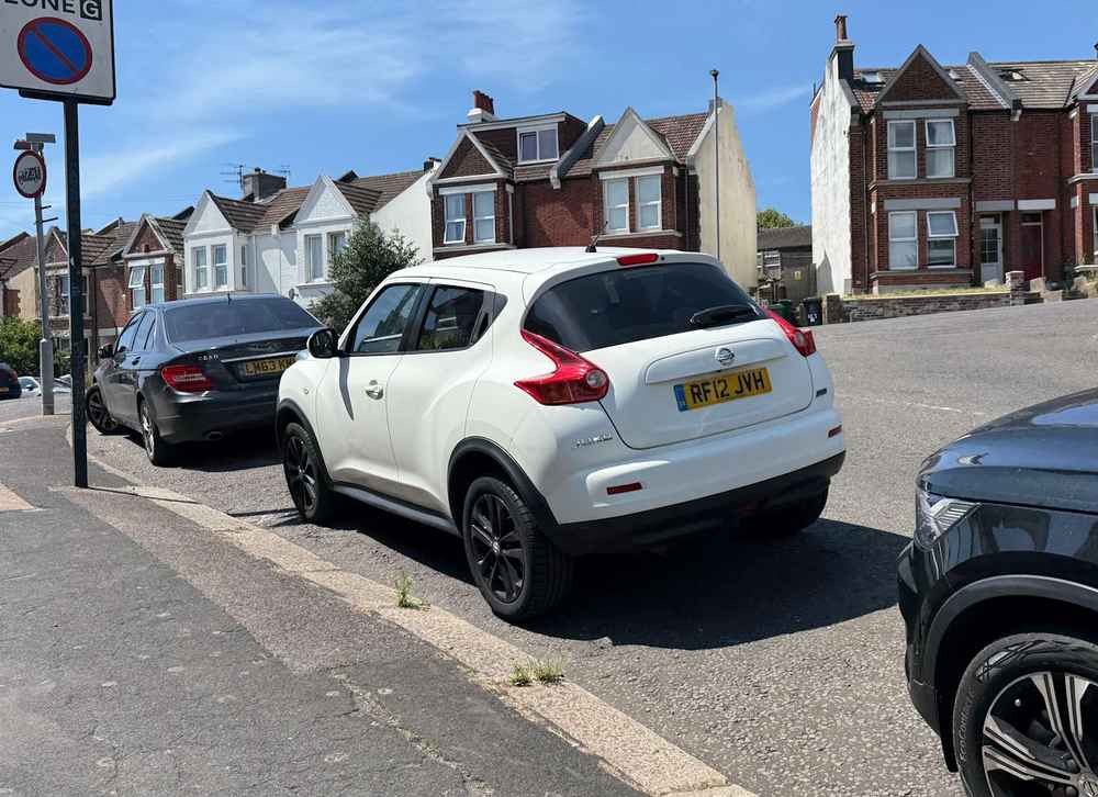 Photograph of RF12 JVH - a White Nissan Juke parked in Hollingdean by a non-resident who uses the local area as part of their Brighton commute. The fifteenth of twenty-five photographs supplied by the residents of Hollingdean.