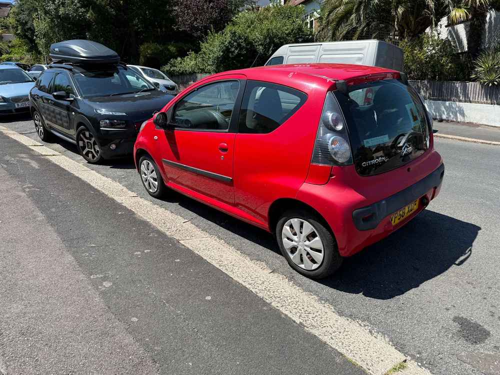 Photograph of YP58 XDF - a Red Citroen C1 parked in Hollingdean by a non-resident, and potentially abandoned. The fifteenth of twenty photographs supplied by the residents of Hollingdean.