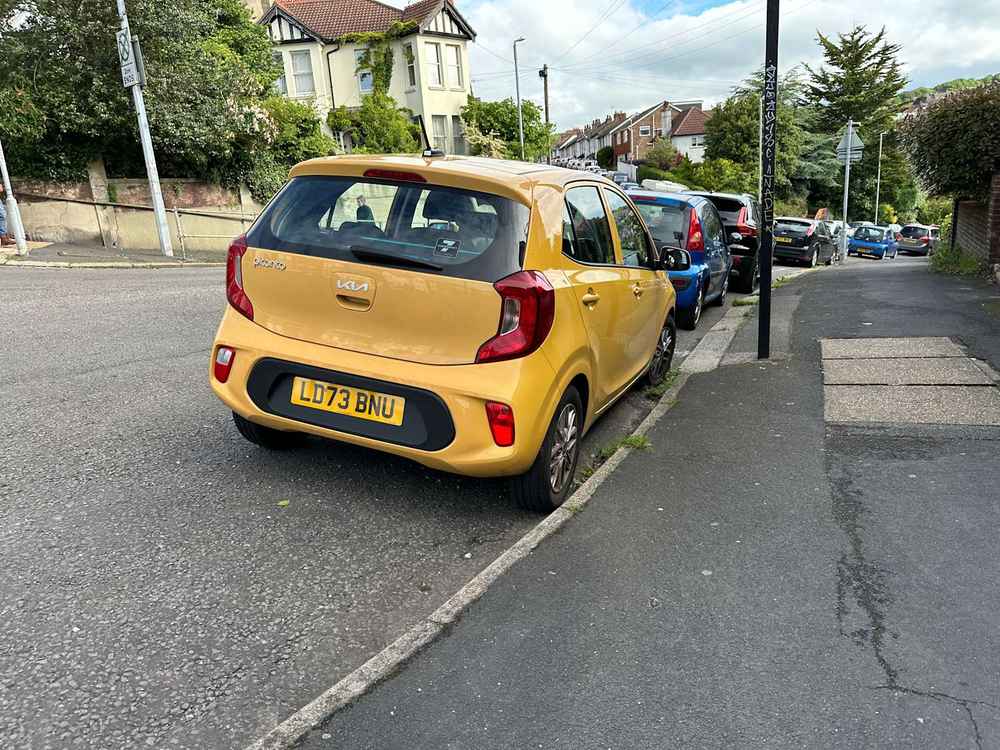 Photograph of LD73 BNU - a Yellow Kia Picanto parked in Hollingdean by a non-resident. The second of twelve photographs supplied by the residents of Hollingdean.