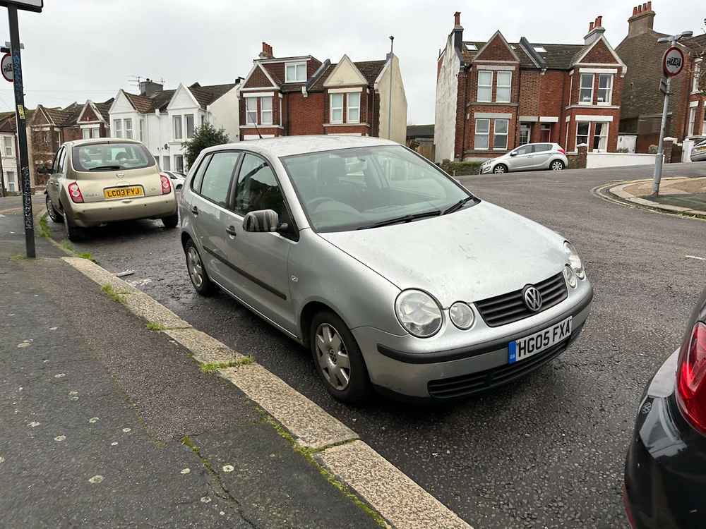 Photograph of HG05 FXA - a Silver Volkwsagen Polo parked in Hollingdean by a non-resident, and potentially abandoned. The first of three photographs supplied by the residents of Hollingdean.