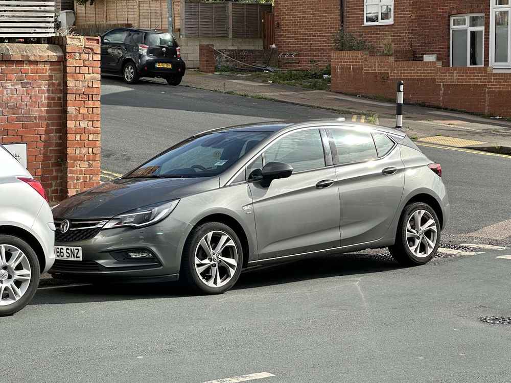 Photograph of WV66 SNZ - a Beige Vauxhall Astra parked in Hollingdean. The second of two photographs supplied by the residents of Hollingdean.