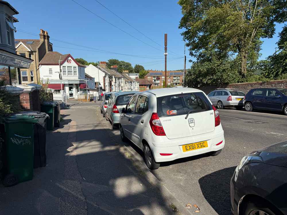 Photograph of EX61 XSC - a White Hyundai i10 parked in Hollingdean by a non-resident who uses the local area as part of their Brighton commute. The seventh of seven photographs supplied by the residents of Hollingdean.