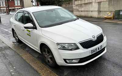 DA15 WJD, a White Skoda Octavia parked in Hollingdean