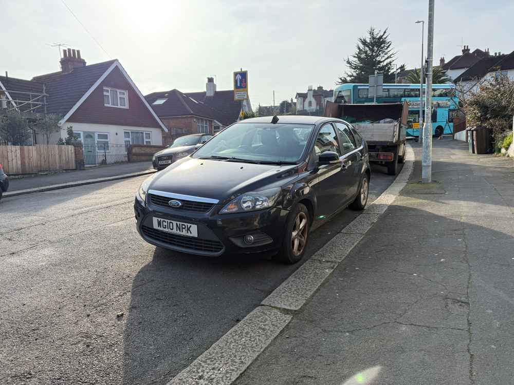 Photograph of WG10 NPK - a Black Ford Focus parked in Hollingdean by a non-resident. The fifth of five photographs supplied by the residents of Hollingdean.