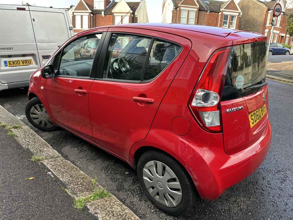 Photograph of SD60 BVS - a Red Suzuki Splash parked in Hollingdean by a non-resident. The first of two photographs supplied by the residents of Hollingdean.