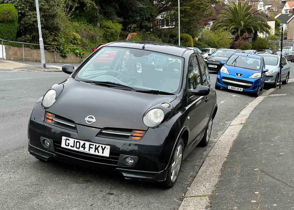 Photograph of GJ04 FKY - a Black Nissan Micra parked in Hollingdean by a non-resident. The first of six photographs supplied by the residents of Hollingdean.