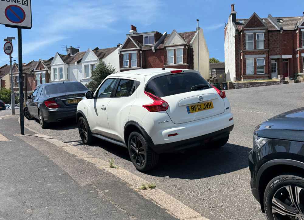 Photograph of RF12 JVH - a White Nissan Juke parked in Hollingdean by a non-resident who uses the local area as part of their Brighton commute. The fifteenth of fifteen photographs supplied by the residents of Hollingdean.