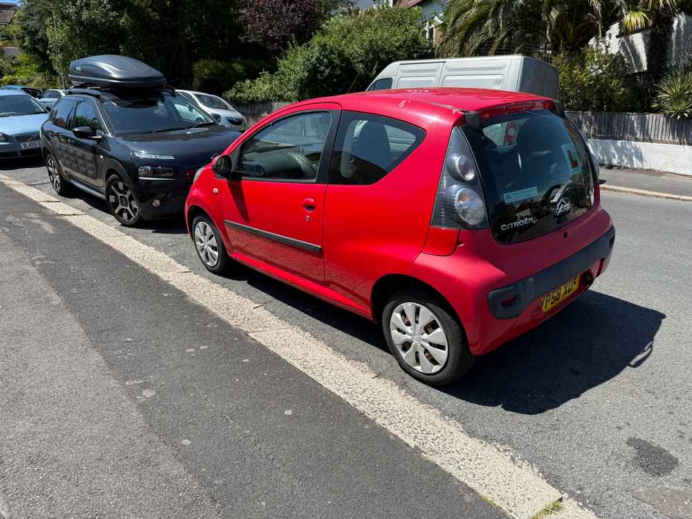 Photograph of YP58 XDF - a Red Citroen C1 parked in Hollingdean by a non-resident, and potentially abandoned. The fifteenth of fifteen photographs supplied by the residents of Hollingdean.