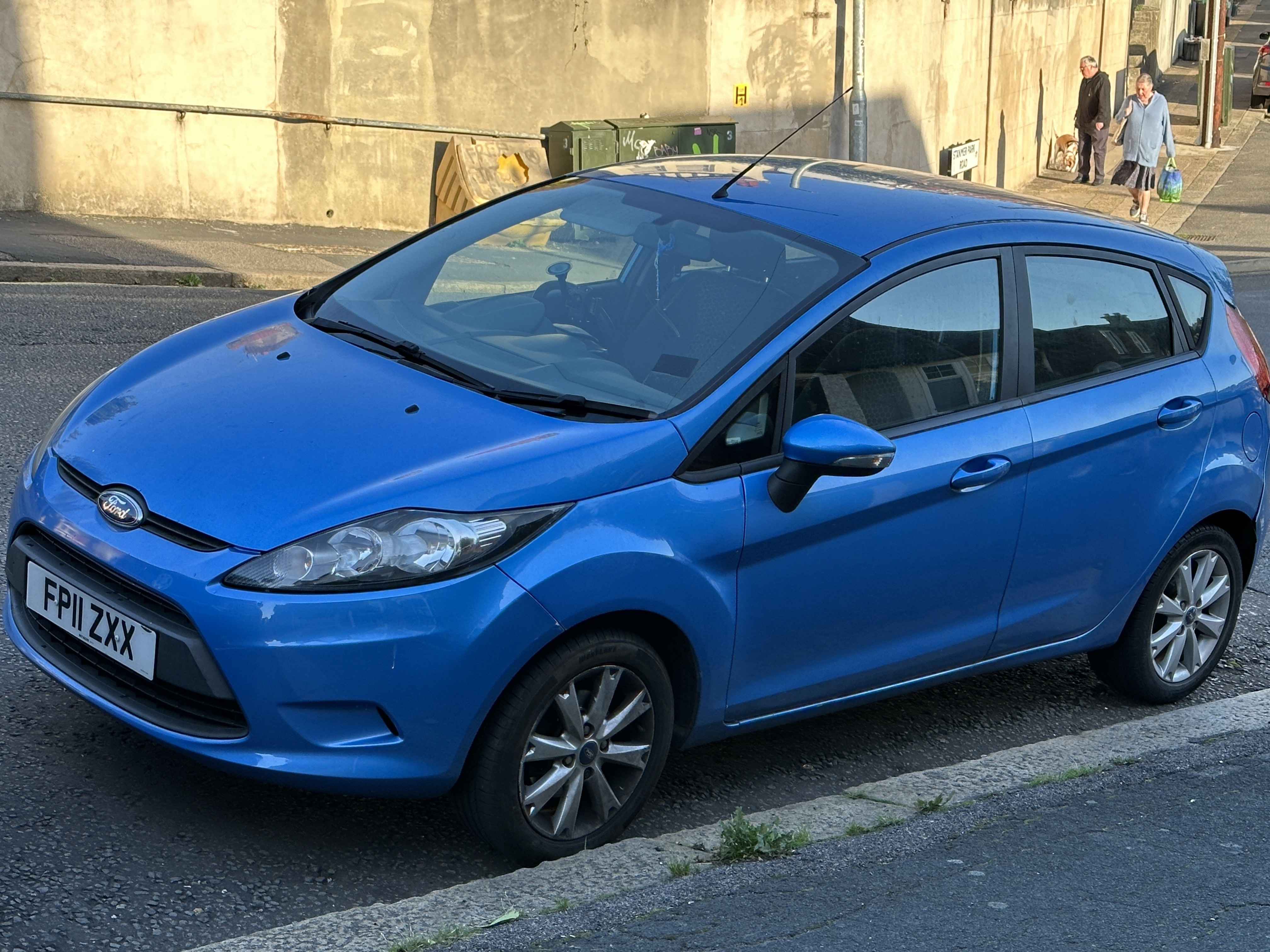 Photograph of FP11 ZXX - a Blue Ford Fiesta parked in Hollingdean by a non-resident who uses the local area as part of their Brighton commute. 