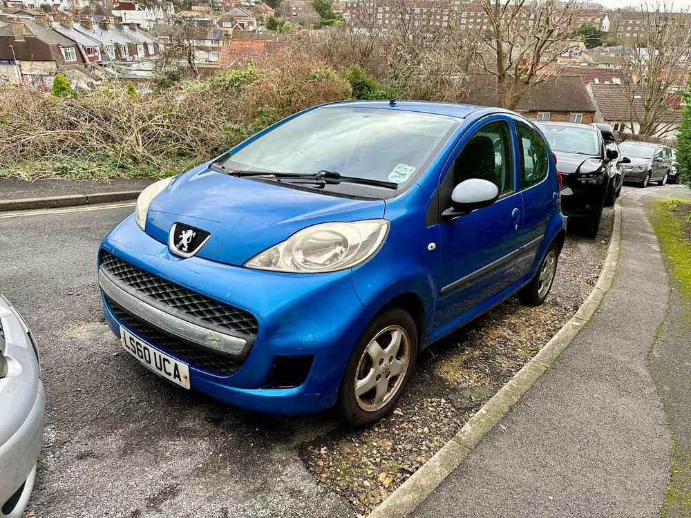 Photograph of LS60 UCA - a Blue Peugeot 107 parked in Hollingdean by a non-resident. The seventh of thirty photographs supplied by the residents of Hollingdean.