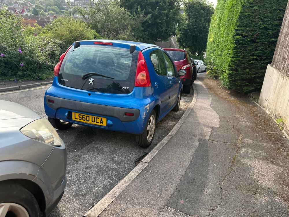 Photograph of LS60 UCA - a Blue Peugeot 107 parked in Hollingdean by a non-resident. The thirteenth of thirteen photographs supplied by the residents of Hollingdean.