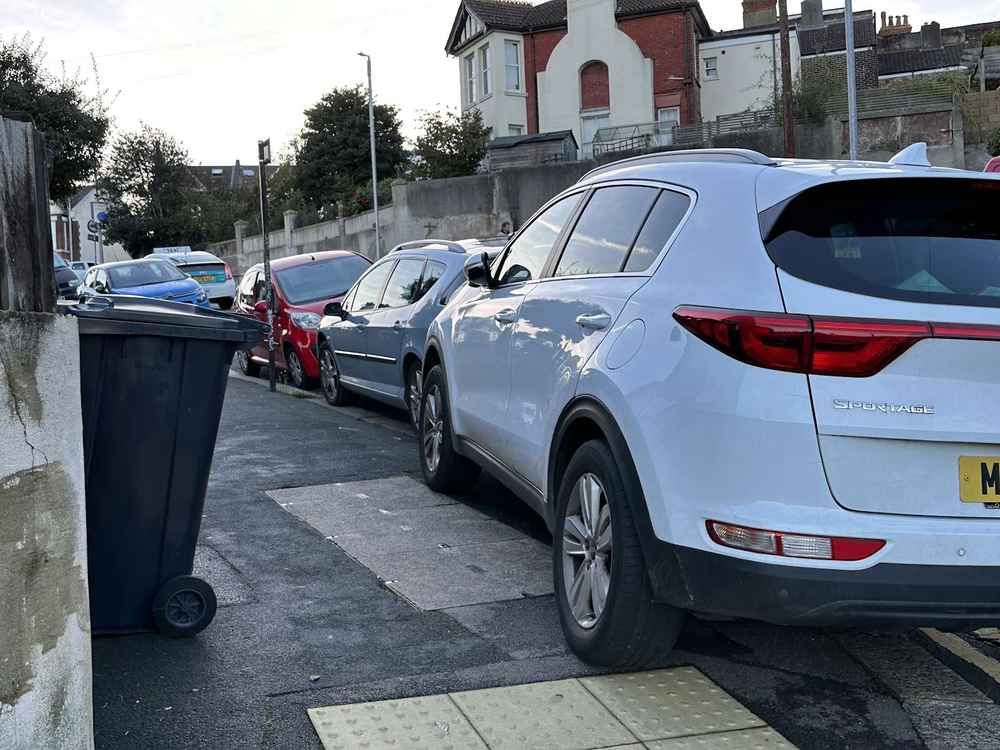 Photograph of MF17 PYV - a White Kia Sportage parked in Hollingdean by a non-resident. The second of two photographs supplied by the residents of Hollingdean.