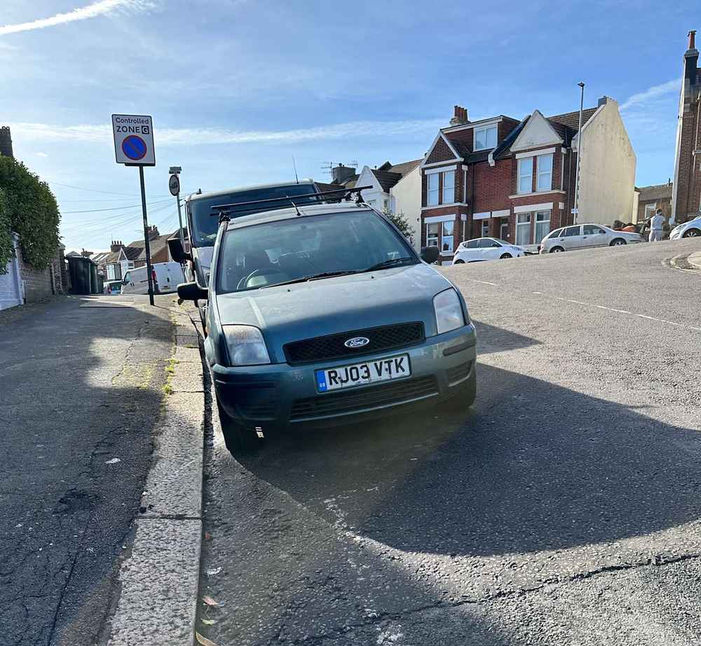 Photograph of RJ03 VTK - a Green Ford Fusion parked in Hollingdean by a non-resident. The second of five photographs supplied by the residents of Hollingdean.