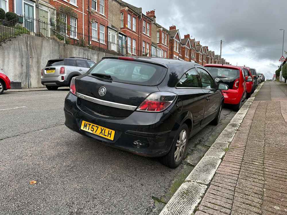 Photograph of MT57 XLH - a Black Vauxhall Astra parked in Hollingdean by a non-resident. 