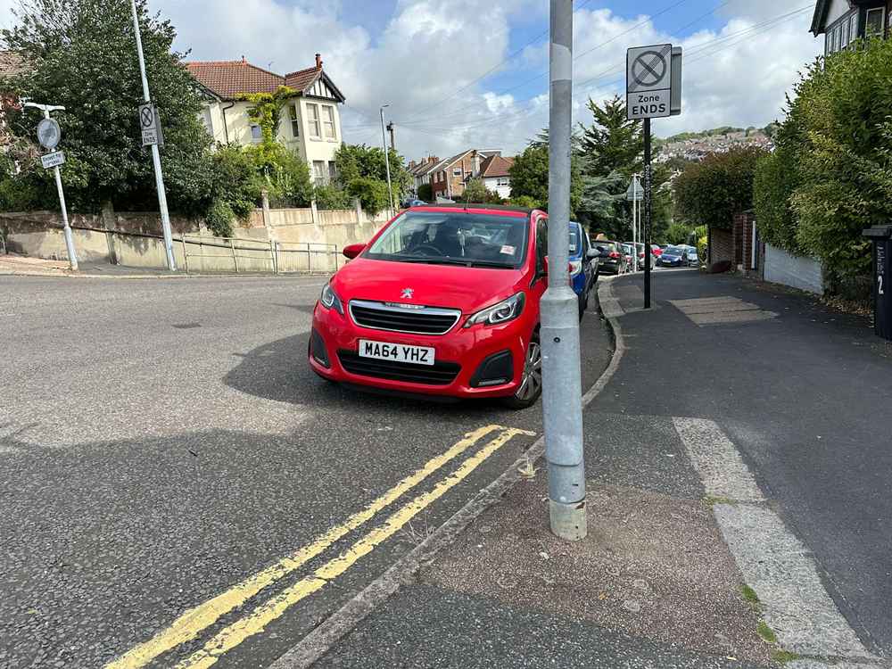 Photograph of MA64 YHZ - a Red Peugeot 108 parked in Hollingdean by a non-resident who uses the local area as part of their Brighton commute. The eighth of fourteen photographs supplied by the residents of Hollingdean.