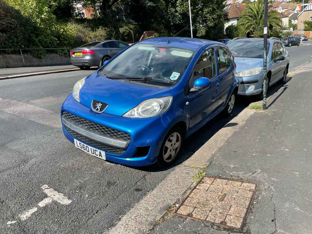 Photograph of LS60 UCA - a Blue Peugeot 107 parked in Hollingdean by a non-resident. The second of thirteen photographs supplied by the residents of Hollingdean.