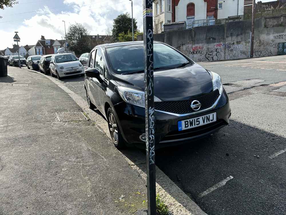 Photograph of BW15 VNJ - a Black Nissan Note parked in Hollingdean by a non-resident who uses the local area as part of their Brighton commute. The sixteenth of twenty photographs supplied by the residents of Hollingdean.